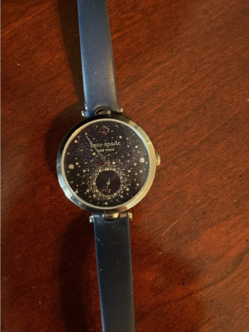 kate spade navy leather strap watch with gold-tone case and black starry dial